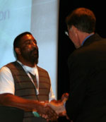 Photo of Jay Jeffries accepting the Go Beyond Award