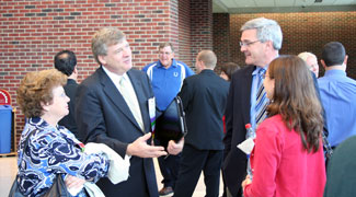 Picture of Phil Wirdzek and Beth Shearer chatting with conference attendees