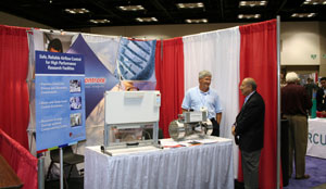 Picture of a Technology and Services Fair vendor chatting with an attendee