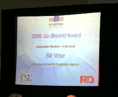 Photo of projection screen congratulating Bill Wise for winning a Go Beyond award